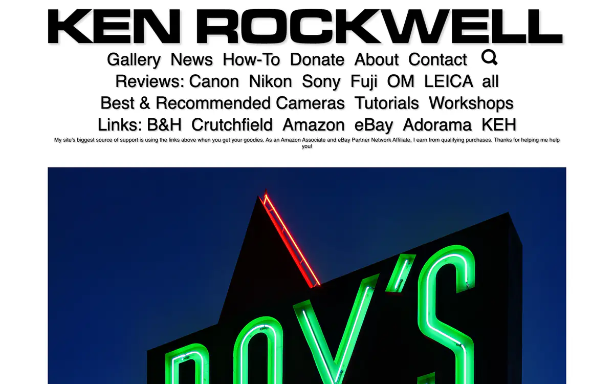 Ken Rockwell homepage: huge black name, a large text menu with camera brands and store links, and a neon sign photo