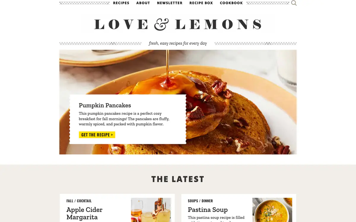 Love and Lemons homepage: spaced serif logo, a large pumpkin pancakes photo with a recipe card, and The Latest section below