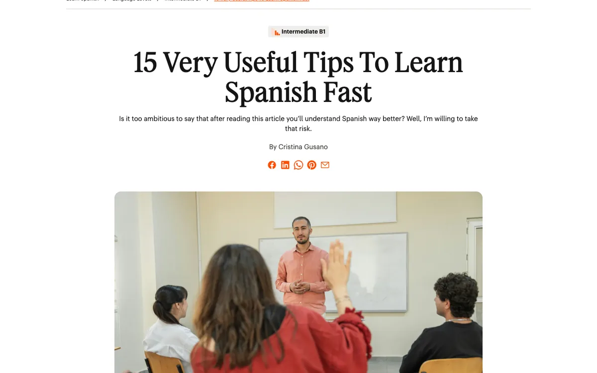 Babbel listicle: large centered headline “15 Very Useful Tips To Learn Spanish Fast”, a level tag, a byline and a classroom photo